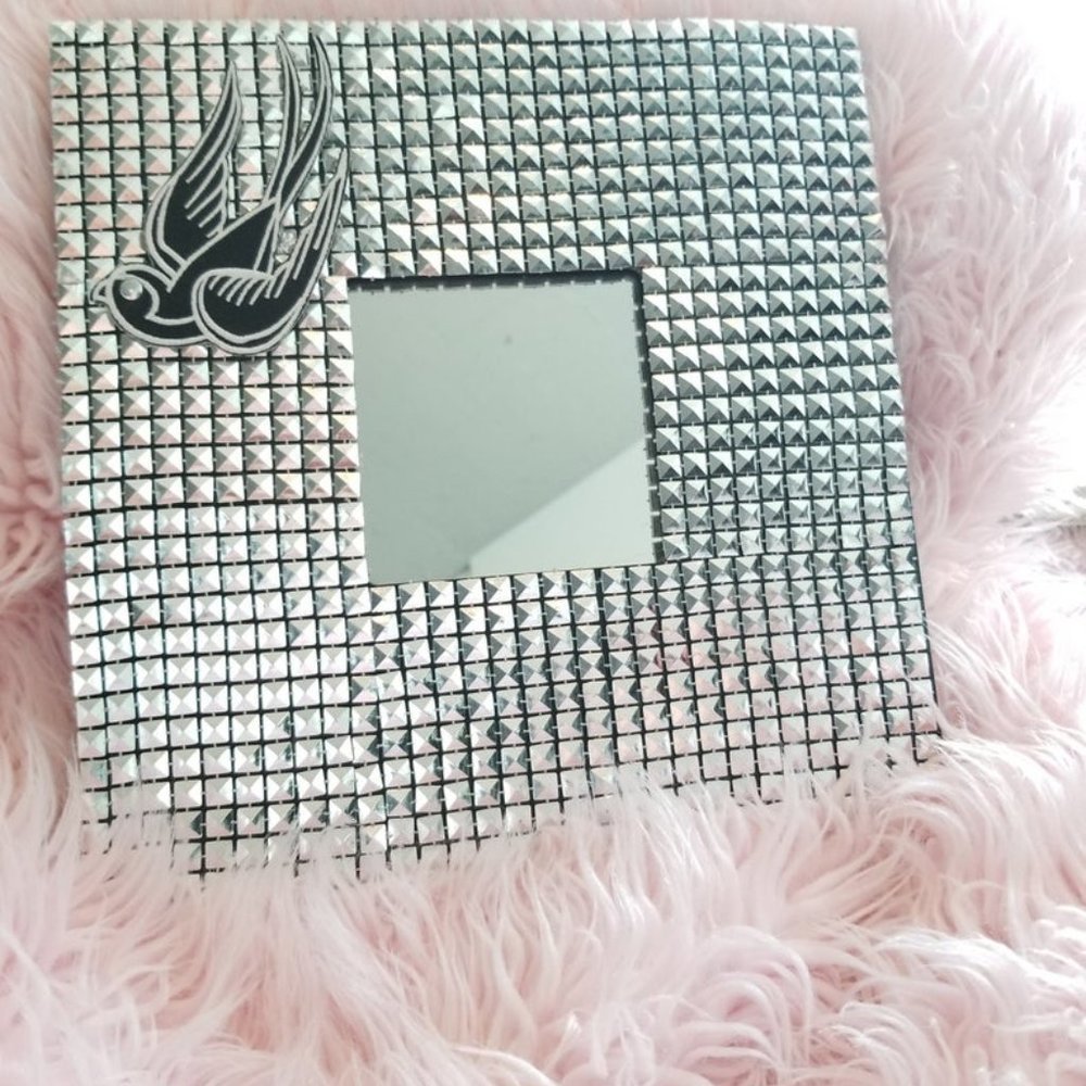 Modern studded wall mirror